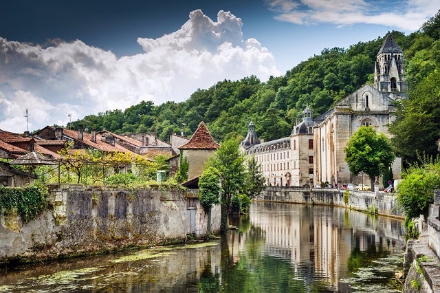 The Abbey of Brantôme stands over the River Dordogne; the picturesque medieval town of Sarlat is a major tourist attraction The Abbey of Brantôme stands over the River Dordogne; the picturesque medieval town of Sarlat is a major tourist attraction 