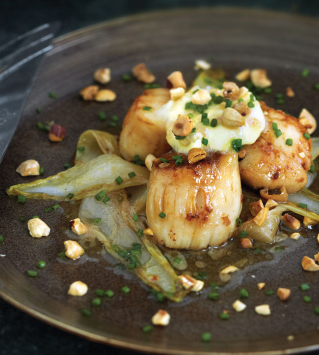 Sautéed scallops with wilted endive, hazelnuts and Sauternes butter