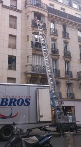 Burke Bros van with a ladder going into a French flat