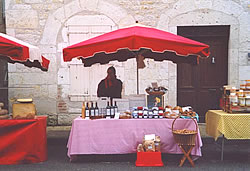 Sue at our market stall in Montcuq